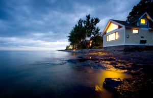 lake superior sunset with beach home